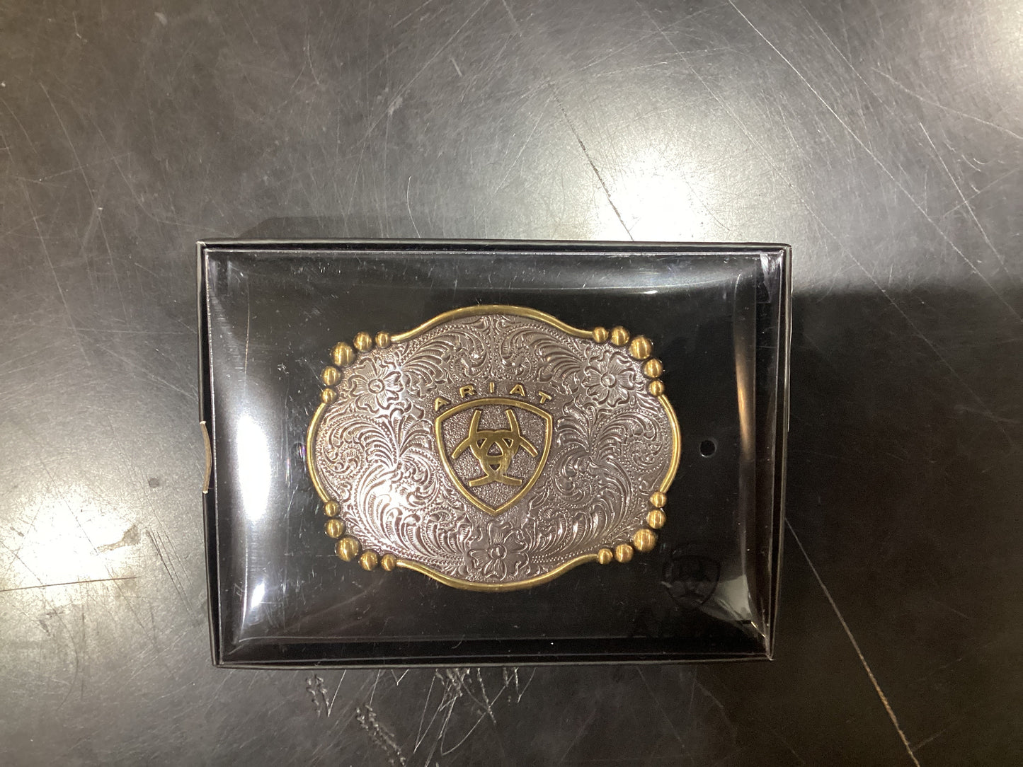 Gold and silver Ariat buckle