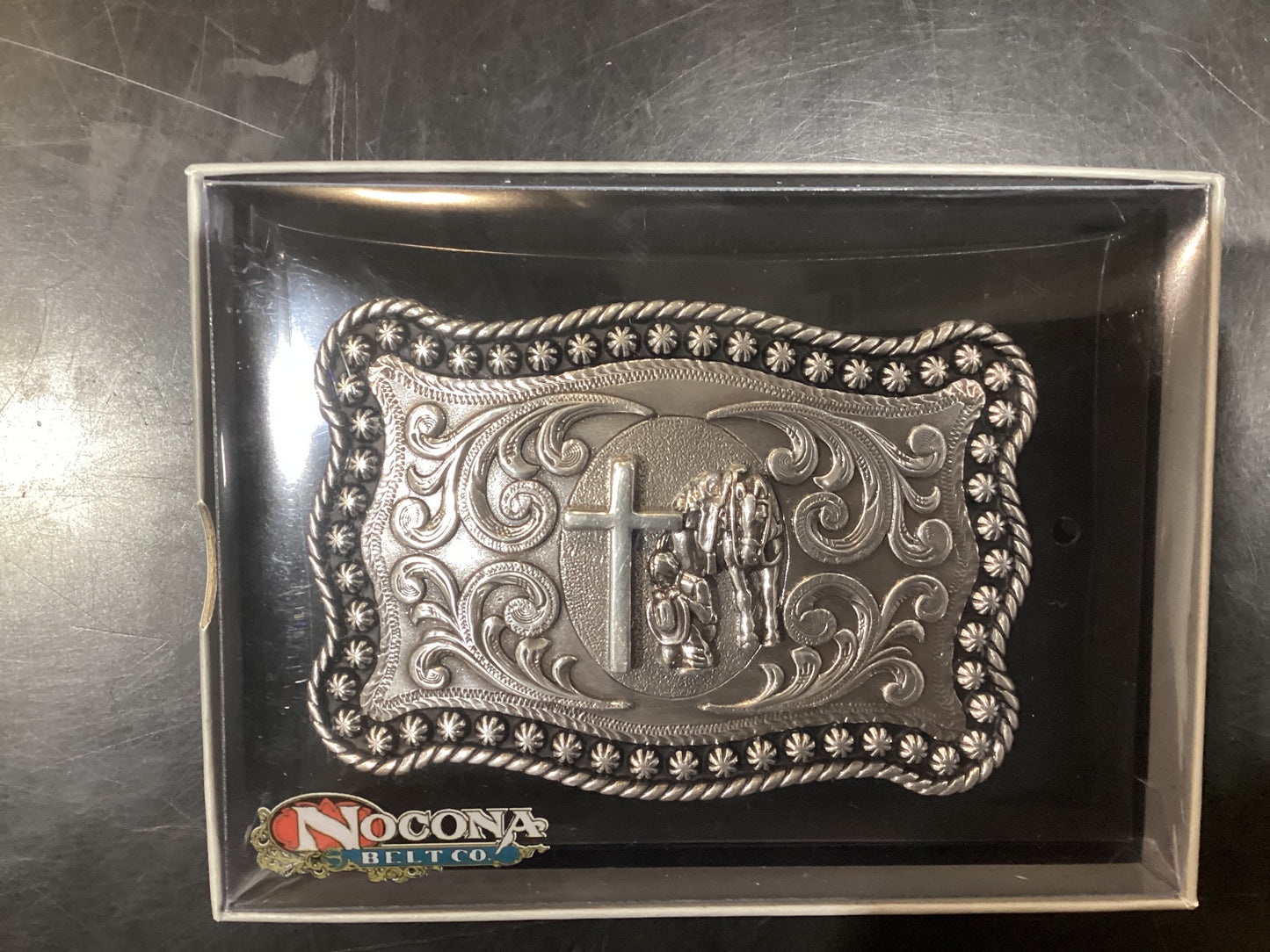 NOCONA silver buckle with cross and cowboy
